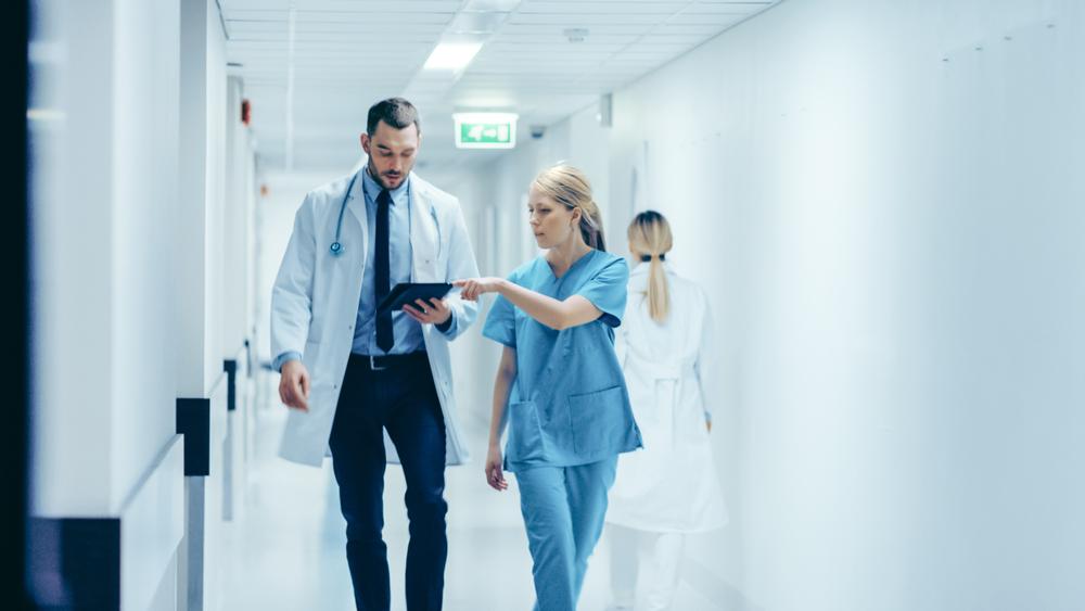 Doctor communicating with nurse