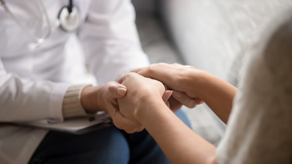 Doctor communicating with patient